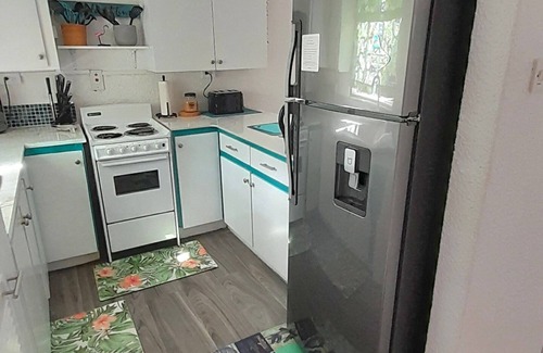 Rendezvous Apartment | Minutes from South Coast Action, Steps from the Green: Private Oasis Awaits.