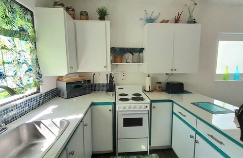 Rendezvous Apartment | Minutes from South Coast Action, Steps from the Green: Private Oasis Awaits.