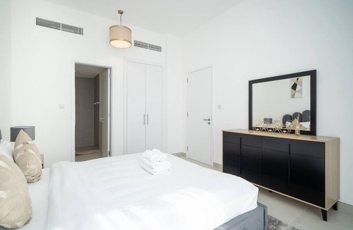 Dubai Investment Park Apartment | StoneTree - Furnished 2BR with floor-to-ceiling window