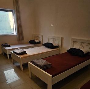 Single Bed in Dormitory Room